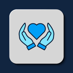 Filled outline Heart in hand icon isolated on blue background. Hand giving love symbol. Valentines day symbol. Vector