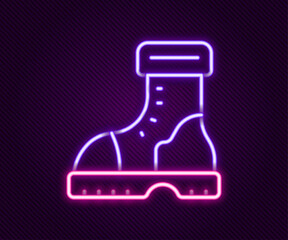 Glowing neon line Waterproof rubber boot icon isolated on black background. Gumboots for rainy weather, fishing, gardening. Colorful outline concept. Vector