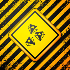 Black Gem stone icon isolated on yellow background. Jewelry symbol. Diamond. Warning sign. Vector