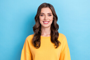 Fototapeta premium Closeup photo of young adorable pretty gorgeous cute woman wear yellow shirt toothy smile curly hair look you employer isolated on blue color background