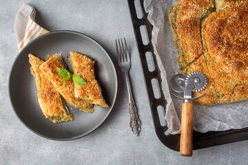 Greek cuisine dishes; spanakopita Sesame on handmade spinach feta cheese pie in the oven. Turkish name; ispanakli borek