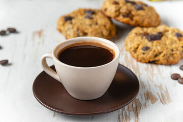Coffee served with chocolate biscuits