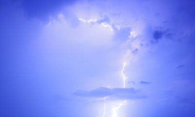 Fork lightning striking down during summer storm