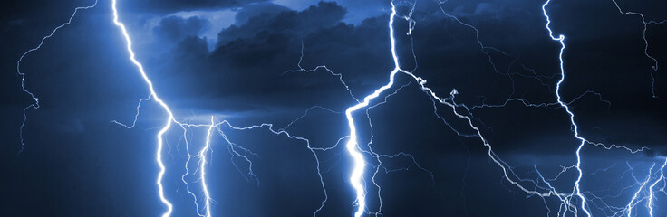 Fork lightning striking down during summer storm