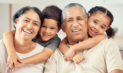 Fototapeta premium Grandkids hug grandparents for love, care and relax in family home together. Portrait of happy children, smile senior grandma and laughing elderly grandpa bond and funny play together in quality time