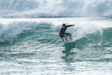 Local surfer riding waves