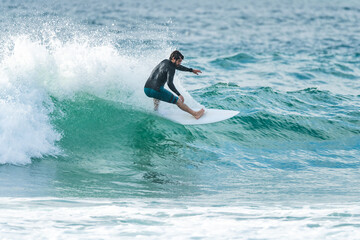 Local surfer riding waves