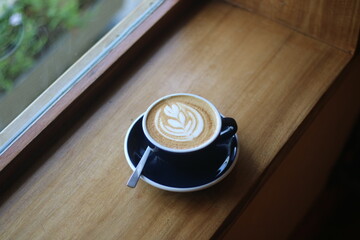 Latte art on the wood table 