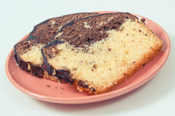 Fresh baked yeast dough with cocoa. Delicious dessert. White background