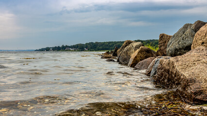 Jetty with stones in the Baltic Sea at Gendarmstien, Denmark