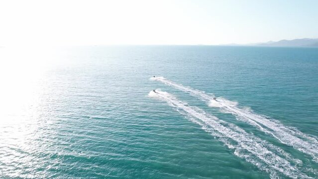 Aerial footage of hydrocycles ride the open water