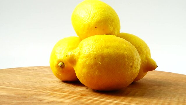 Lemons on a wooden board. Healthy food.