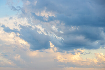 Naklejka na ściany i meble cloudy sky in sunlight,clouds background at sunset