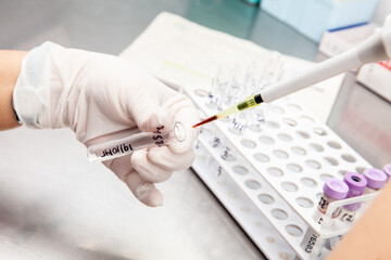 Scientist preparing samples for flow cytometric analysis in the laboratory