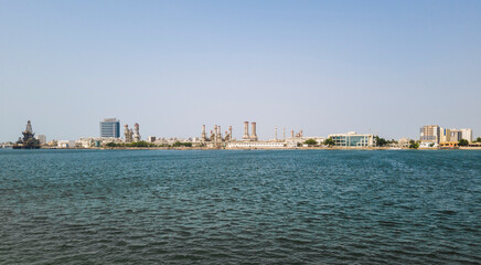 Fototapeta premium Industrial area along the sea shore. Landscape