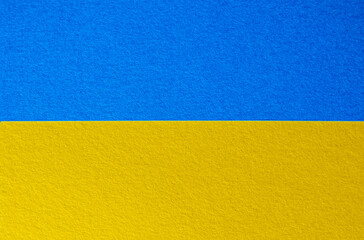 Abstract colored paper in Ukraine national flag colors texture background. Minimal geometric shapes and lines in blue, navy blue, yellow colors