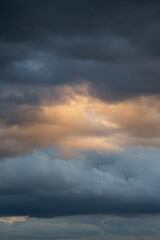 Obraz premium Clouds before a thunderstorm, yellow-blue clouds. Background image, state of mind.