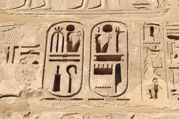 Two pharaonic cartouches deeply carved on the walls of Ramses III temple in Luxor 