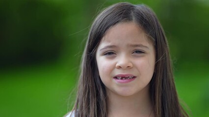 Portrait child with missing teeths smiling at camera