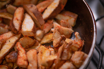 Vegetarian and vegan cuisine using Shitake mushroom and cream for preparation on the stove.