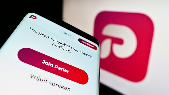 Stuttgart, Germany - 09-18-2022: Mobile phone with website of US social networking company Parler Inc. on screen in front of business logo. Focus on top-left of phone display.