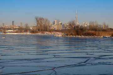 Frozen lake Ontario with Toronto city skyline and CN Tower in the background. Extreme weather,...