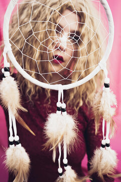 Woman with dream catcher in studio