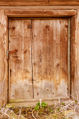 Old wooden door with a retro style hook