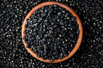 Black Lentils (Maa de Daal, Black matpe beans, Black urad, urad whole). Black Lentils in Pottery.