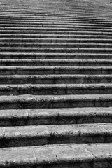 Big stairway leading towards the doors of the &ldquo;Cattedrale di Sant'Andrea&ldquo;, cathedral of Amalfi Italy and monument and tourist attraction. Historic stone steps in bright sunlight, black and white