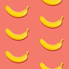 Seamless pattern of bananas on pink background