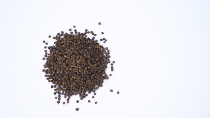 Pile of Organic Black pepper (Piper nigrum) isolated on white background. milled black pepper ,Black pepper corns. Black pepper grains as background close up
