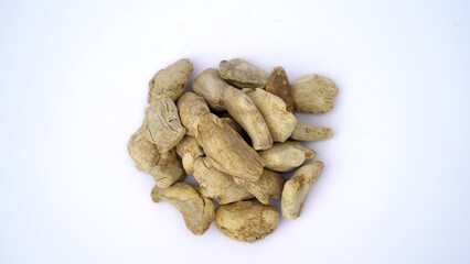 Heap of dried ginger roots on white background. Dried Organic Ginger or Dry Adrak also known as Sonth in India
