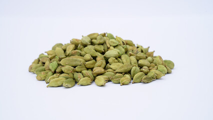 Cardamom pods and seeds isolated on white background. Green cardamom pods isolated on white...
