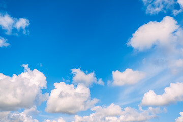 Blue sky with white cumulus clouds moving fast in day light. Cloudscape. Nature background. Windy weather forecast. Religion concept. Heaven landscape. Fresh air. Morning inspiration. Daylight