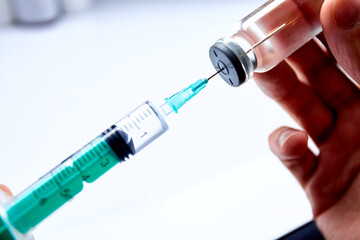  Vaccine in vial with syringe