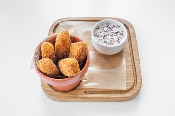 Halloumi Fries with mayo dip served in a dish isolated on grey background top view
