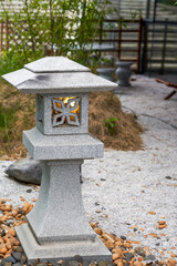 Traditional marble floor lamps in a Japanese garden