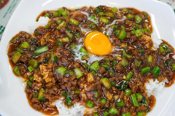 A plate of delicious and tempting nest egg minced beef rice in a Hong Kong-style tea restaurant