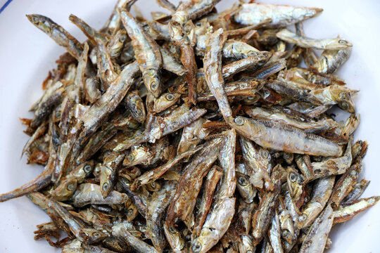 Small dried fish in the market ready to eat. Background