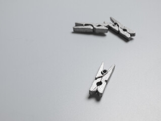 Top view of spring-type wooden clothespins in gray