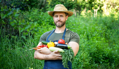 farmer villager in straw hat hold fresh ripe vegetables