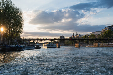 Fototapeta premium Sunset at Pont des Arts, Paris, France or Passerelle des Arts is a pedestrian bridge that has an international reputation as the bridge of romance.
