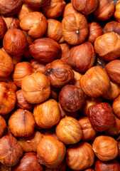 Heap of hazelnuts close-up. Peeled nuts. Hazelnut isolated on white background.