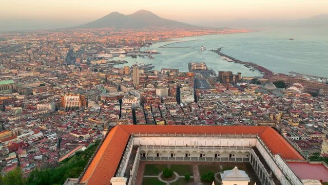 Naples at sunset, aerial view of Italian city of Naples and gulf of Naples, vacations in southern Italy, famous European tourist destination