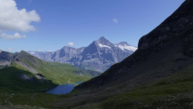View of Lake Bachalpsee and  Alps panorama on a sunny day, Grindelwald Switzerland. Panasonic Lumix S1 ProRes422HQ (4K, 29.97fps, Vlog basic color correction)