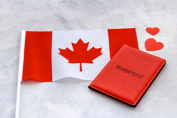 Flag of Canada with passport. Travel visa and citizenship concept
