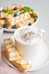 Sfogliatine glassate. Italian glazed dessert with cappuccino