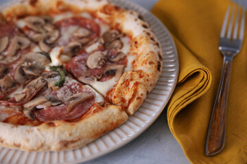 Dinner with Neapolitan pizza with sausage and mushrooms