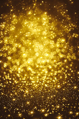 Golden glitter bokeh lighting texture Blurred abstract background for birthday, anniversary, wedding, new year eve or Christmas
